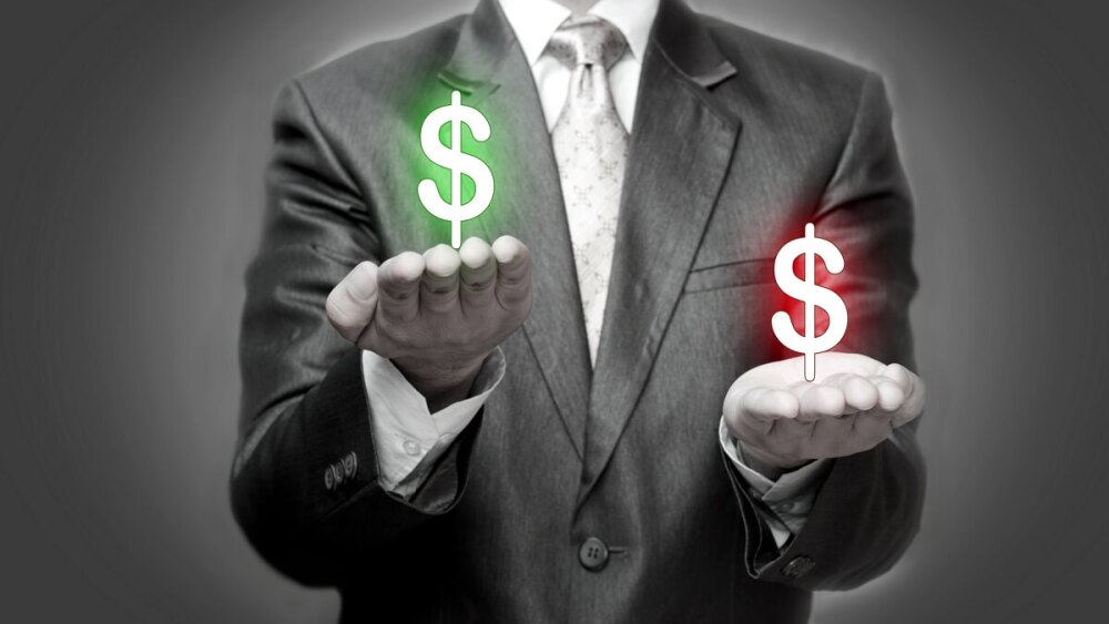 green and red dollar signs, one hand making money trading options, who's losing money.jpg