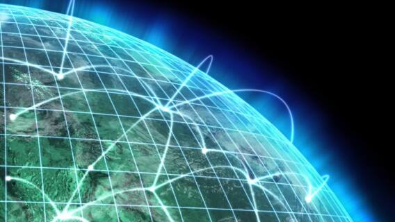 Glowing lines over the globe representing telecom networks such as those of AT&T and Verizon