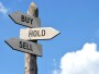 Wooden signpost - buy, hold, sell small caps, small-cap stocks