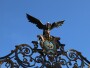 Iron condor and coat of arms above gate
