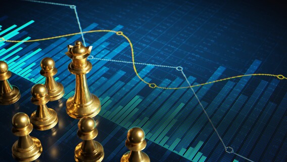 gold chess pieces on a stock chart signifying winning options trades and stock trades
