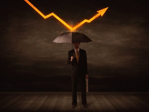 Businessman standing with umbrella keeping orange arrow concept on background-1