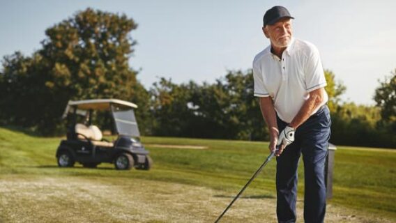 happy-retired-man-playing-golf