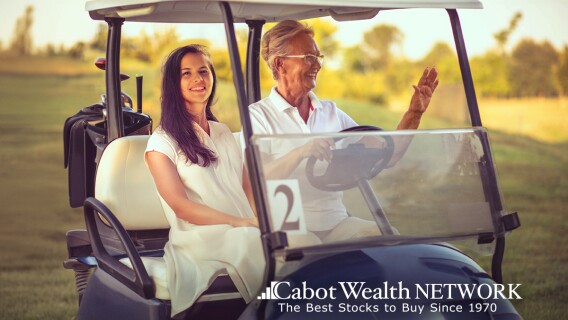 Two women in a golf cart