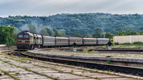 Green train arriving, representing railroad stocks on the right track