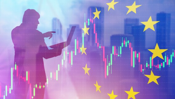 European stocks. Financial market of European union. Silhouette of investor with laptop. Flag of Europe near businessman. Investments in European union. 