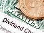 Dollar coin on dividend stock certificate, but are the dividends qualified?