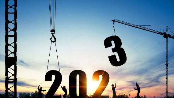 year-end-trade-to-close-out-2023-cranes-hauling-away-3-with-silhoutte-workers
