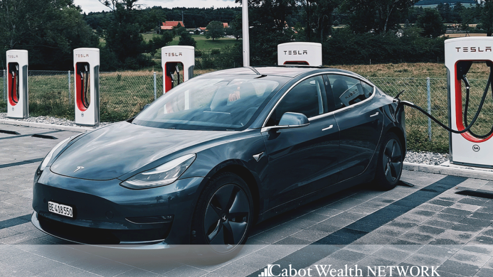 A Tesla Charging at a Tesla Charging Station 