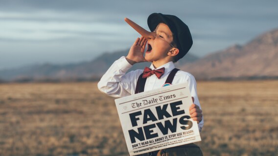 Old Fashioned Pinocchio News Boy Holding Fake Newspaper, Media Lied About Michael Burry Put Buying